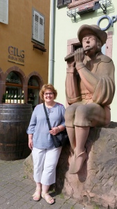 I'm posing demurely with the minstrel statue in Ribeauville.